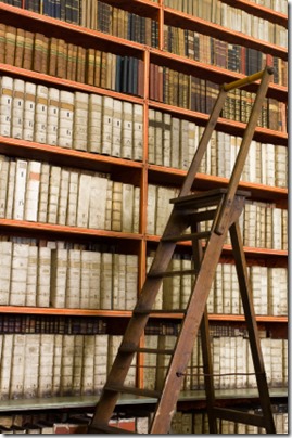 Library full of aged books and ladder